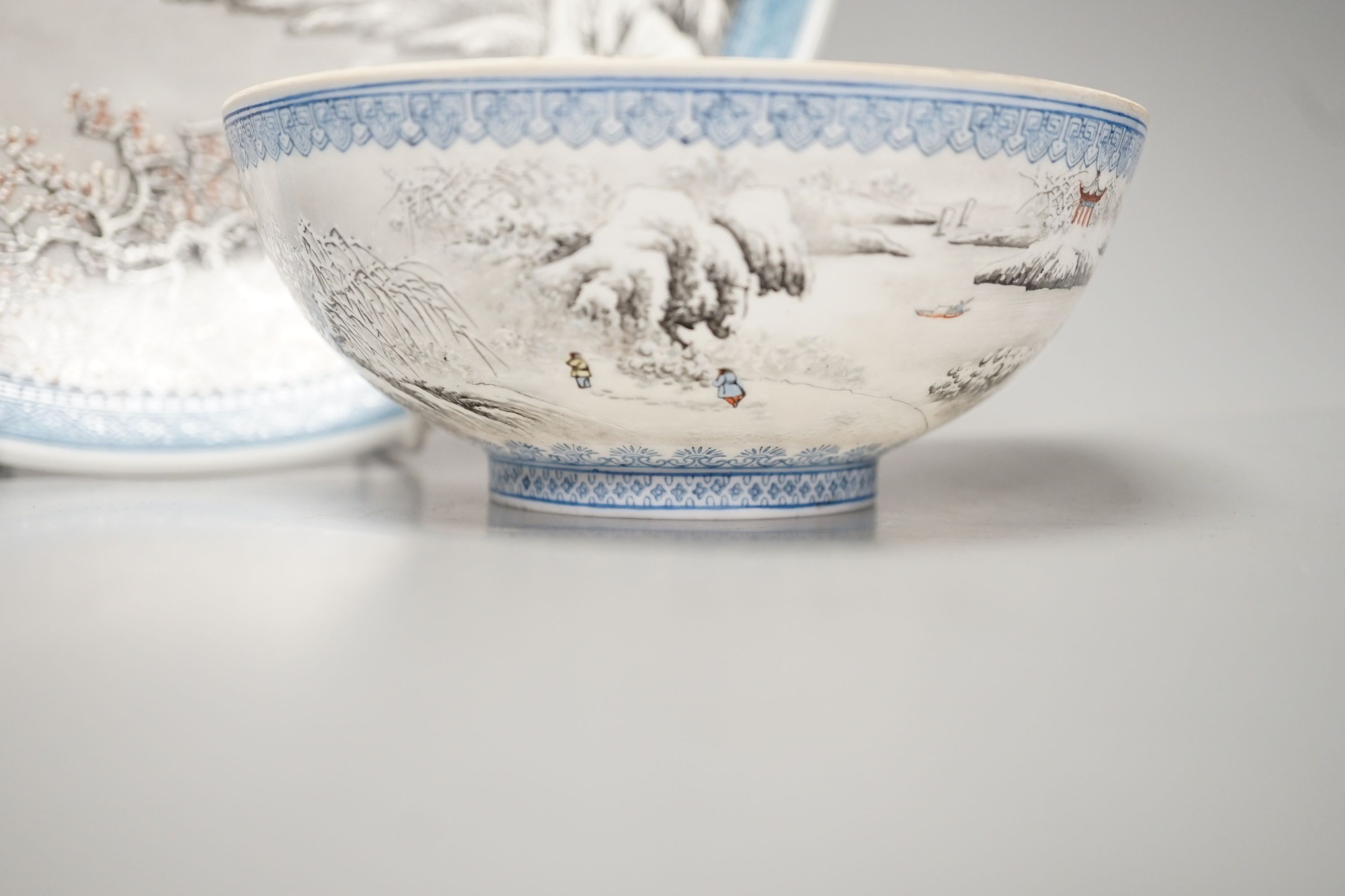 A Chinese enamelled porcelain snow scene dish, diameter 31cm, and a similar smaller eggshell bowl